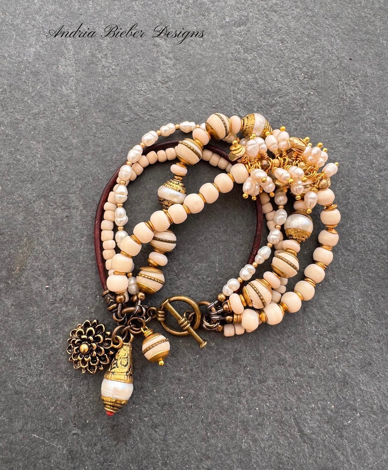 pearls, moonstone, java glass, leather, bone, African brass