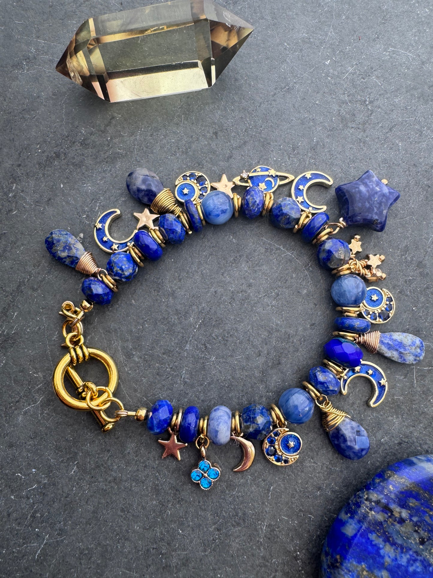 Space Charm bracelet. Mixed gemstone, charms and gold metal bracelet.