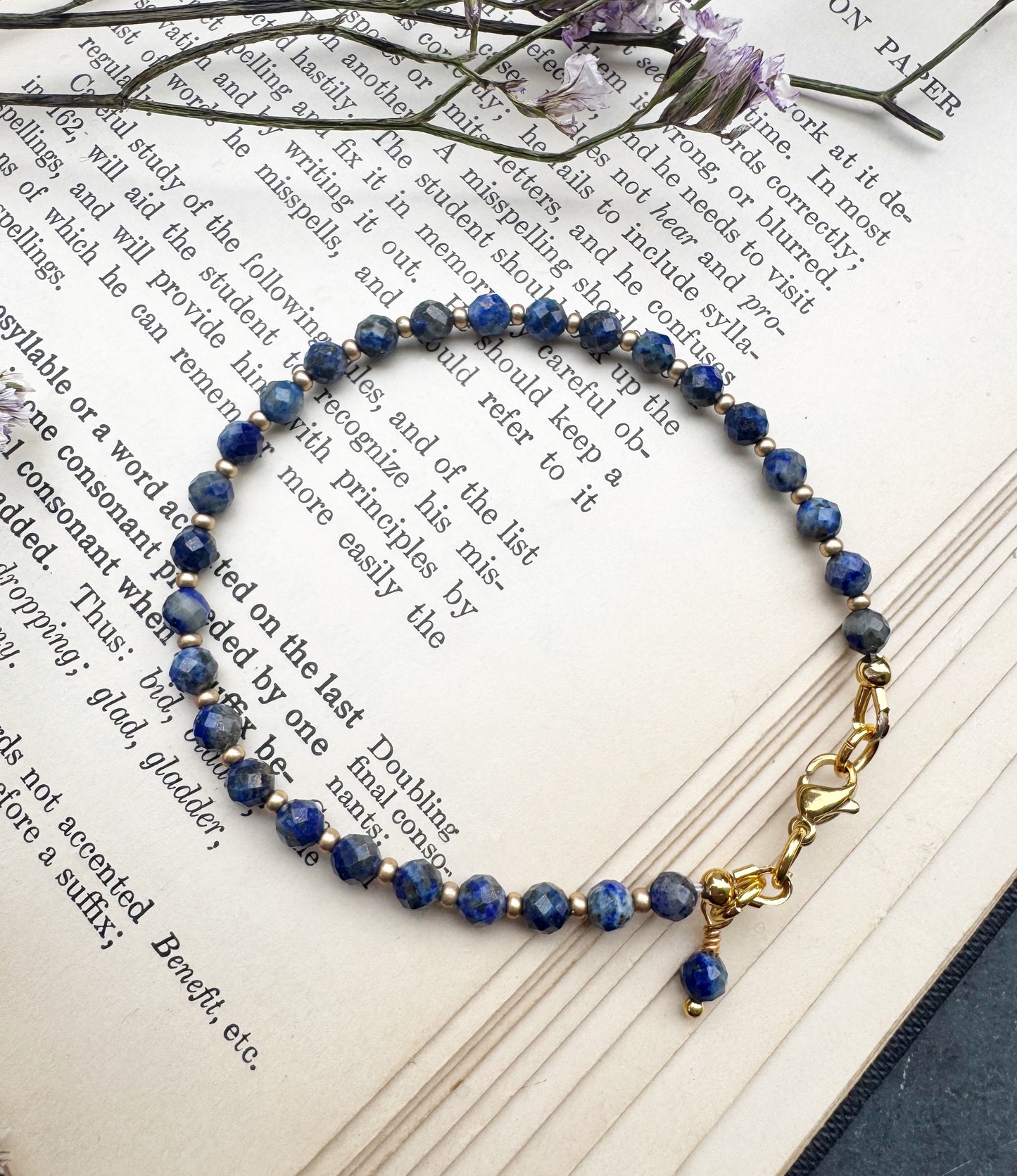 Lapis Lazuli round faceted stone, gold metal, bracelet