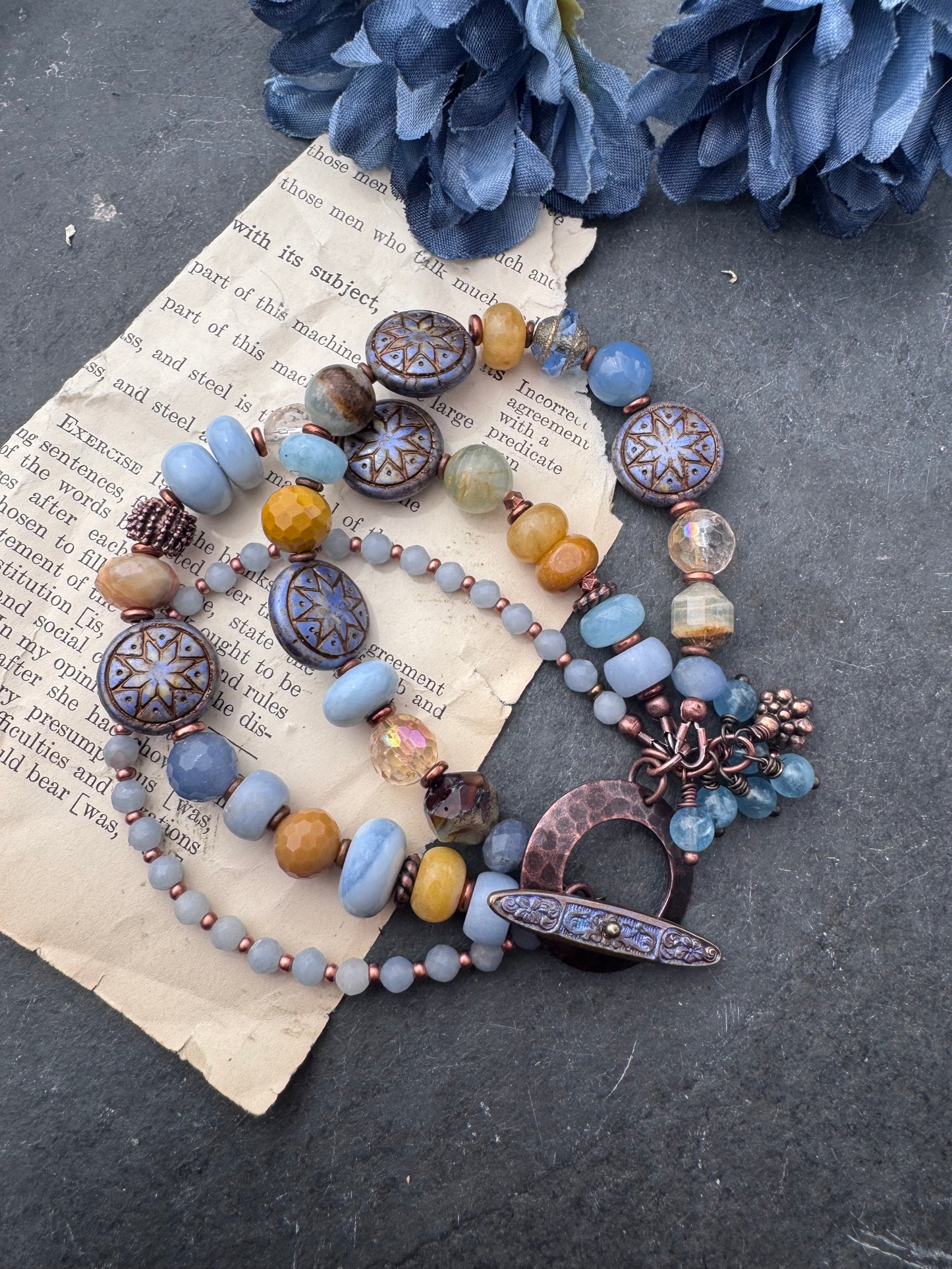 Blue opal, yellow jasper, Czech glass, citrine, agate, blue aventurine, Aquatine Lemurian Blue Calcite and copper metal.