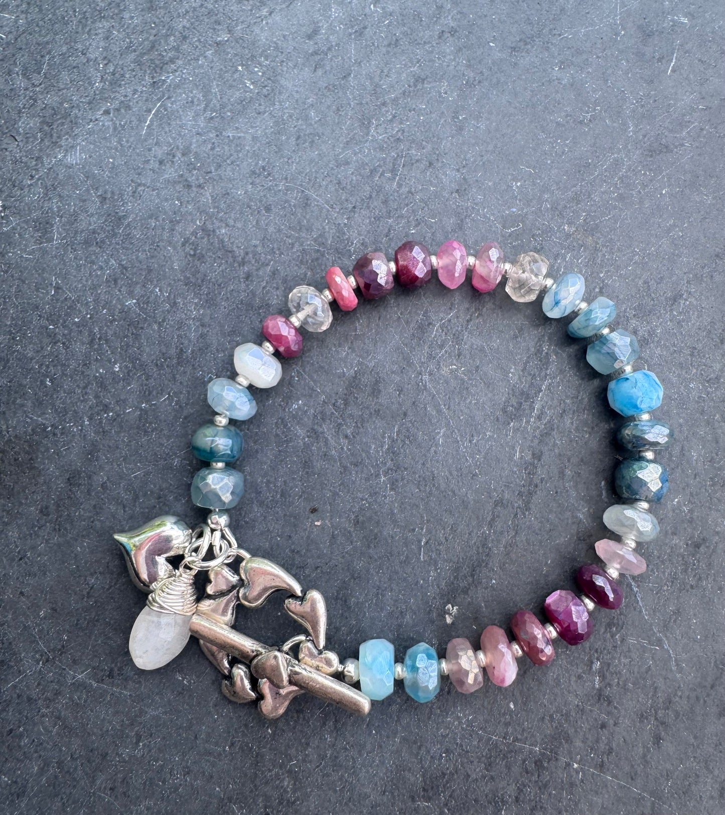 Charm, blue and pink moonstone bracelet. Silver metal bracelet.