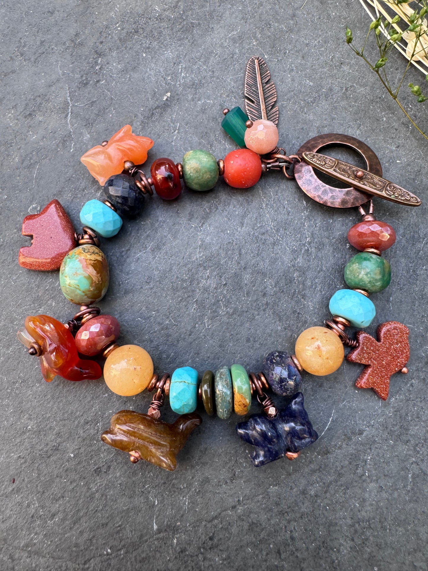 Turquoise, lapis, carnelian agate, sunstone, mixed stone, copper bracelet. Animal stone charms.