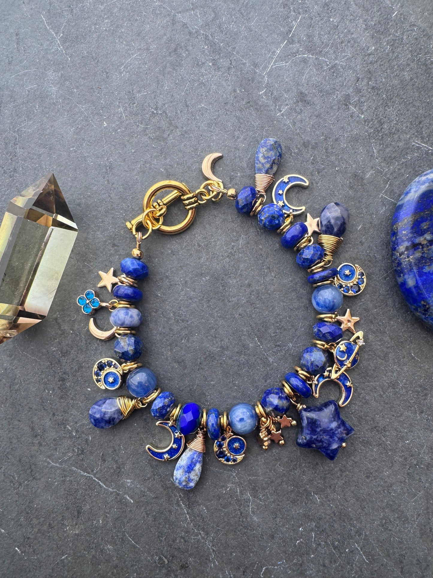 Space Charm bracelet. Mixed gemstone, charms and gold metal bracelet.