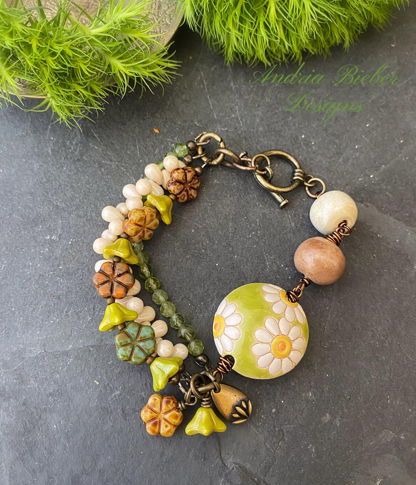 Daisies. Peridot stone, Czech glass flowers, ceramic beads, brinze metal, multi strand, bracelet