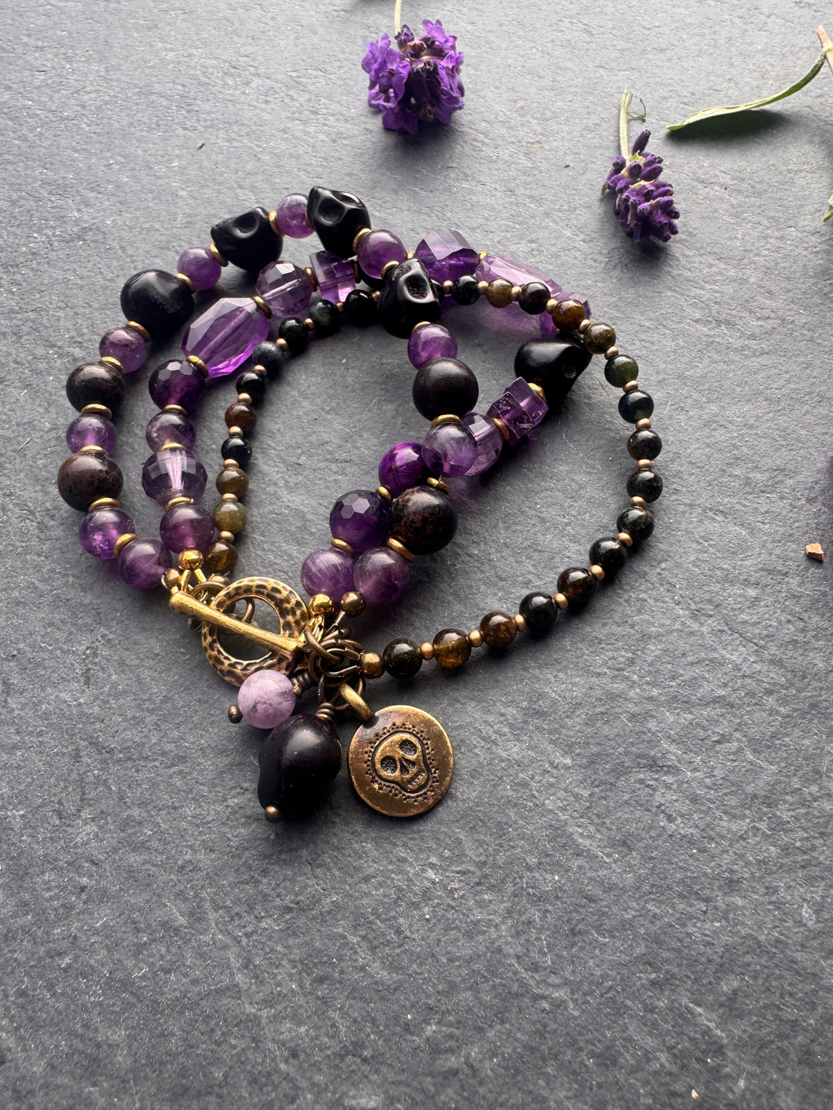 Amethyst stone, black skulls, black jasper, gold metal, Halloween, bracelet.