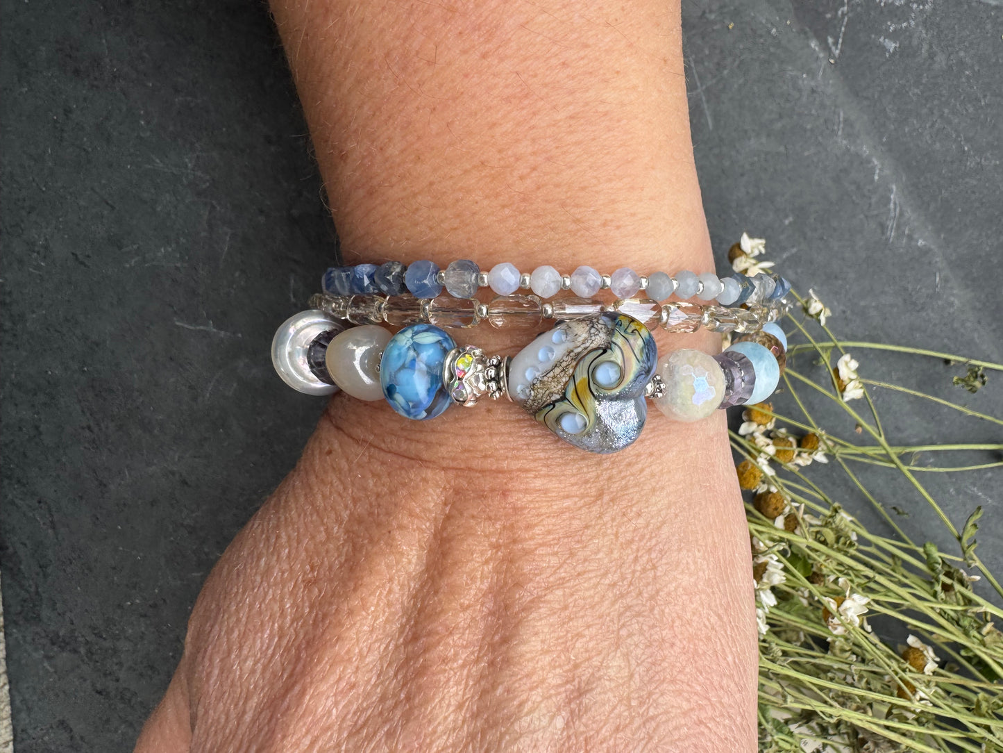 Lamp work glass, blue opal, blue kyanite, mystic moonstone, mystic citrine, pearls, iolite, aquamarine, crazy lace blue agate, blue aventurine stone, silver metal, rhinestone clasp, bracelet