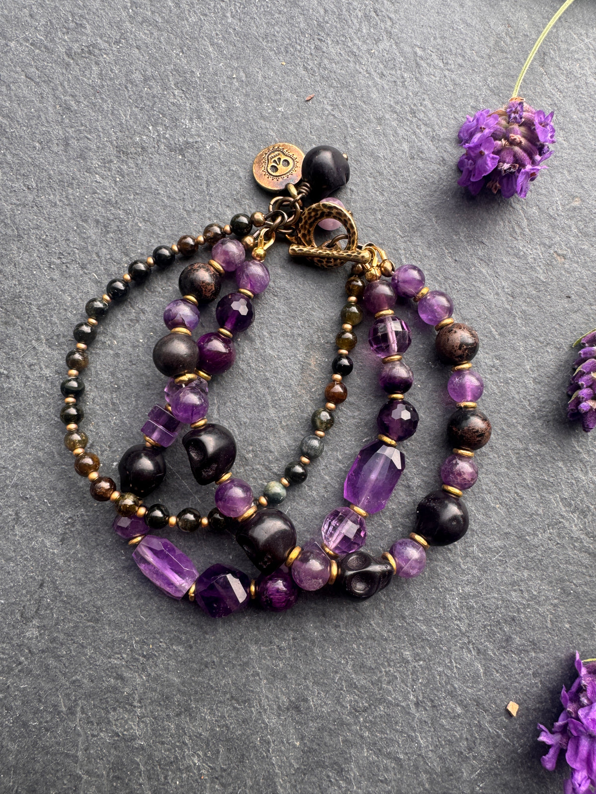 Amethyst stone, black skulls, black jasper, gold metal, Halloween, bracelet.