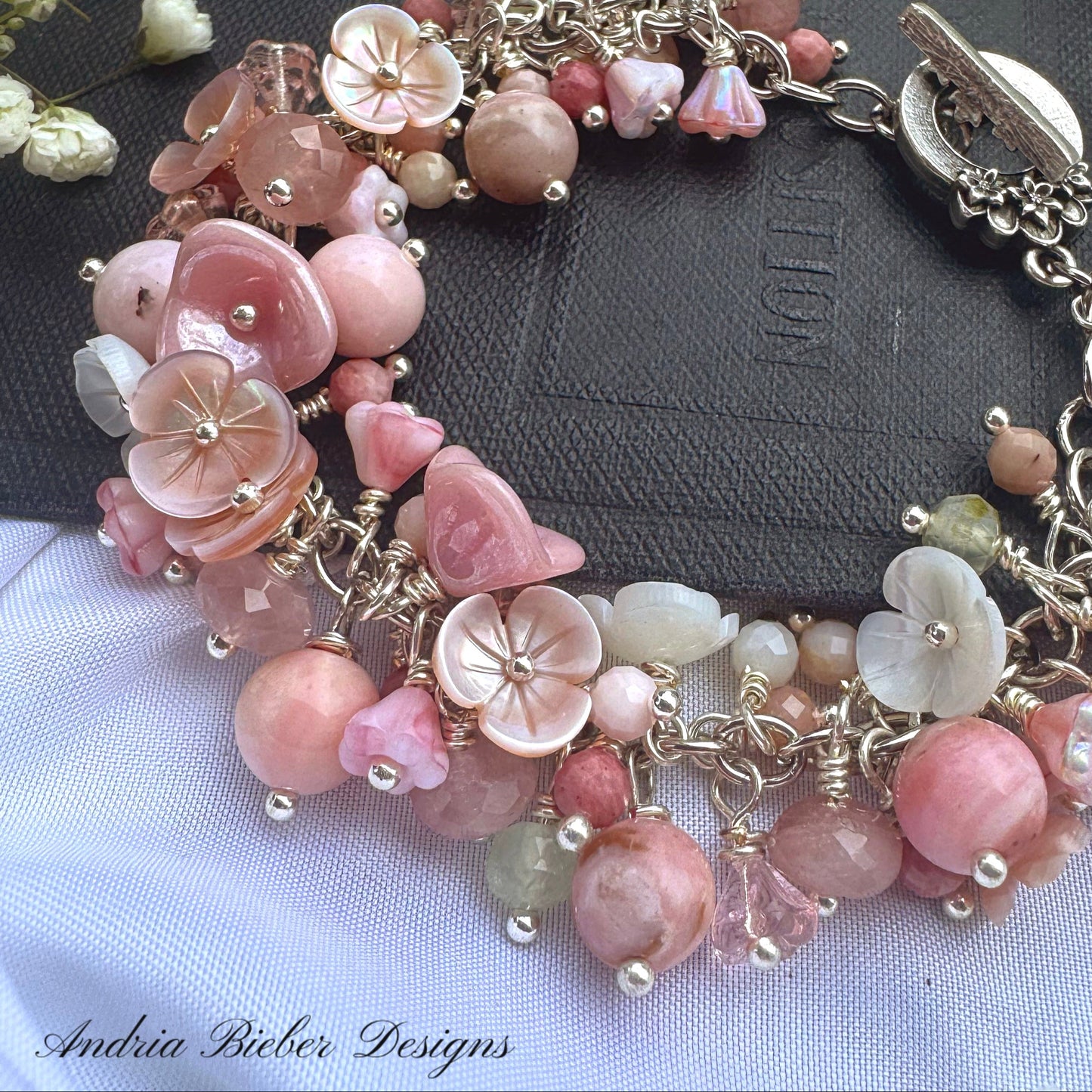 Pink opal, pink shell blossoms, rose quartz, peridot, sterling silver metal, blossom clasp, bracelet.