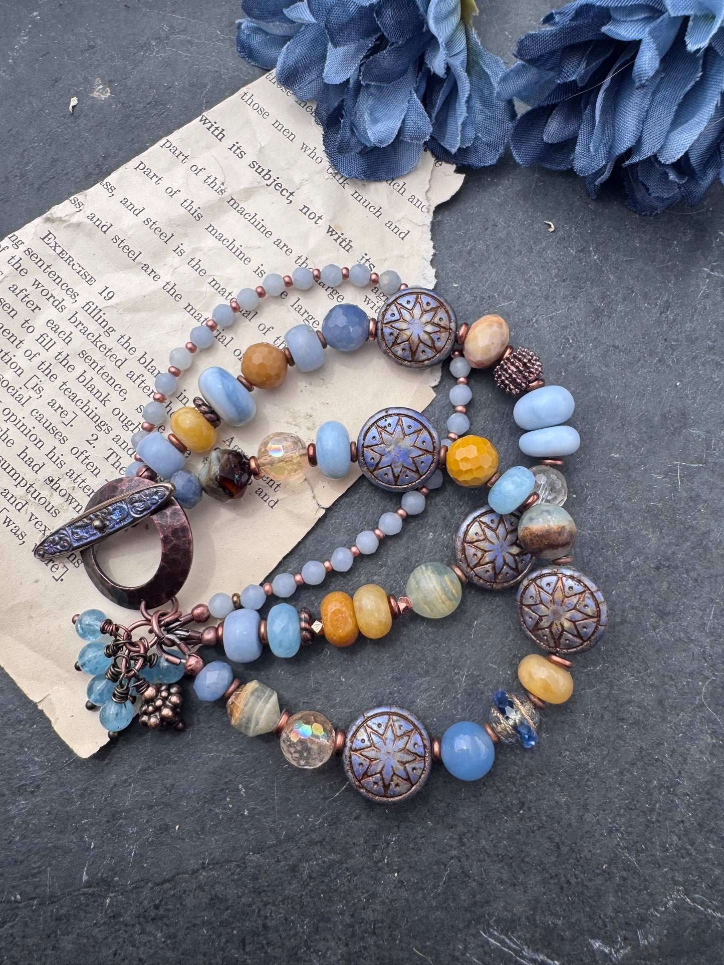 Blue opal, yellow jasper, Czech glass, citrine, agate, blue aventurine, Aquatine Lemurian Blue Calcite and copper metal.