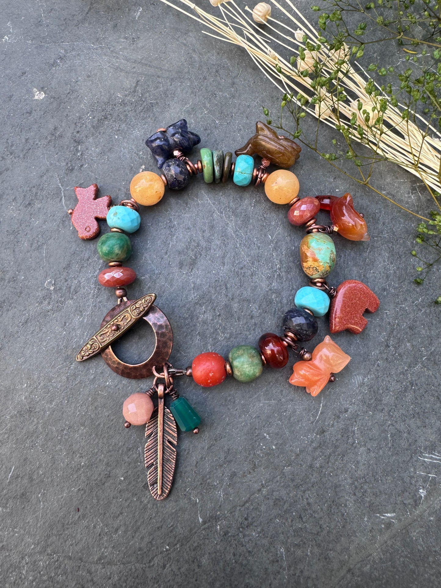 Turquoise, lapis, carnelian agate, sunstone, mixed stone, copper bracelet. Animal stone charms.