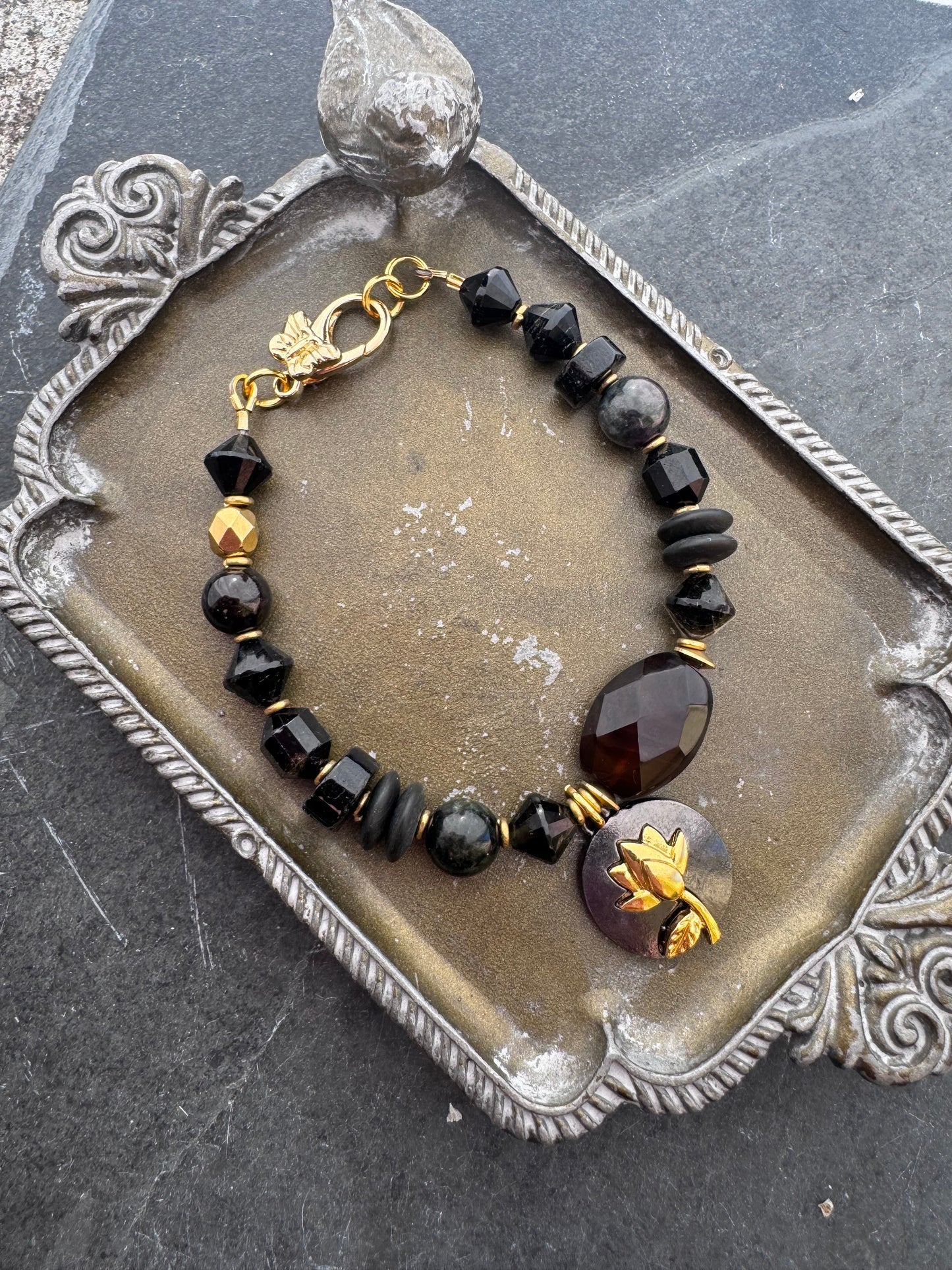 Black tourmaline, agate, black onyx stone, gold metal bracelet.