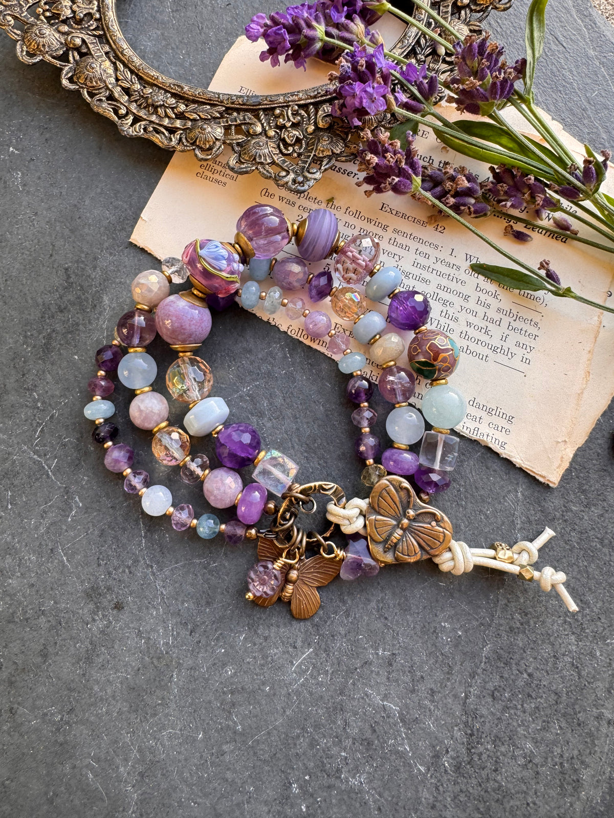 Handmade lampwork glass, 
Amethyst, citrine, aquamarine, faceted green amethyst, fluorite stone, purple oyster, and bronze  butterfly metal button.