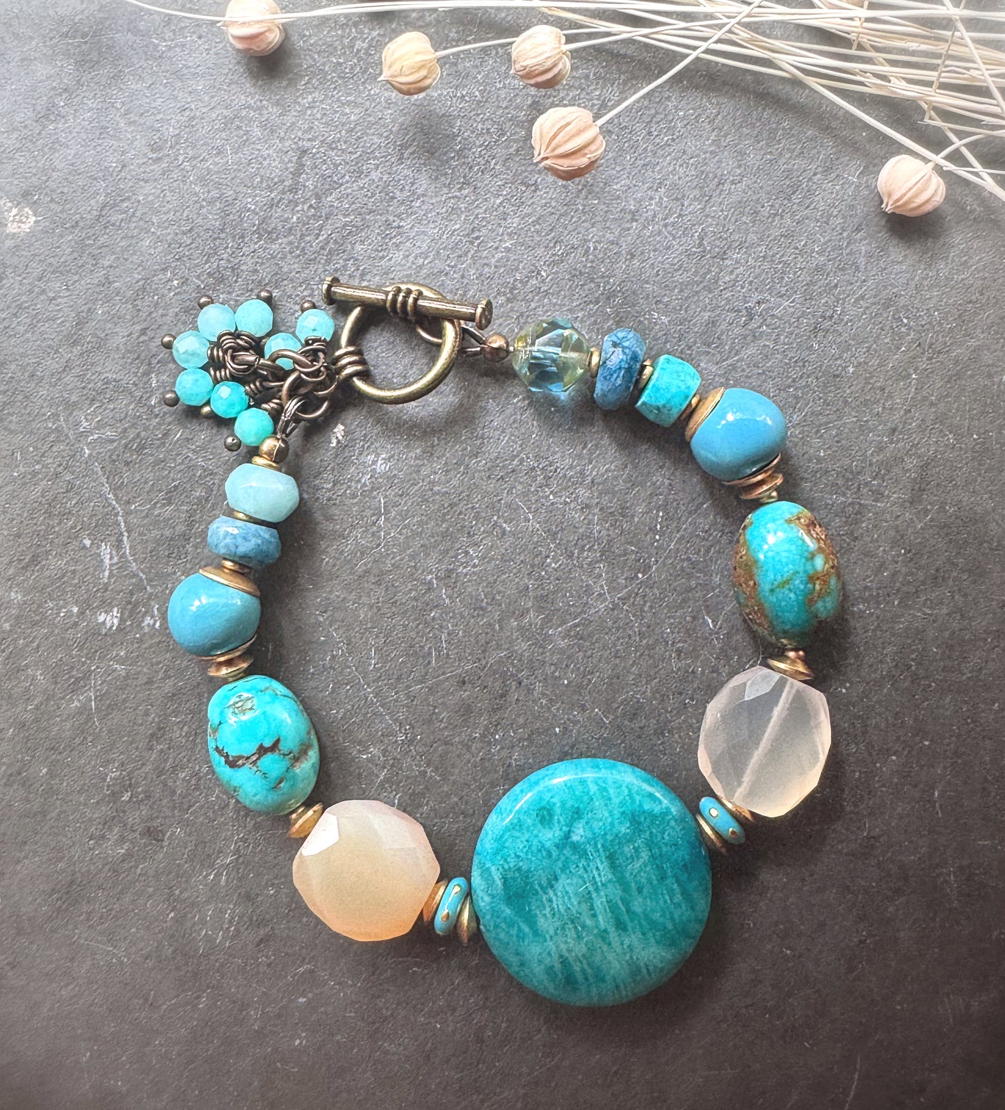 Turquoise, chalcedony, ceramic rounds, apatite stone and African brass bracelet.