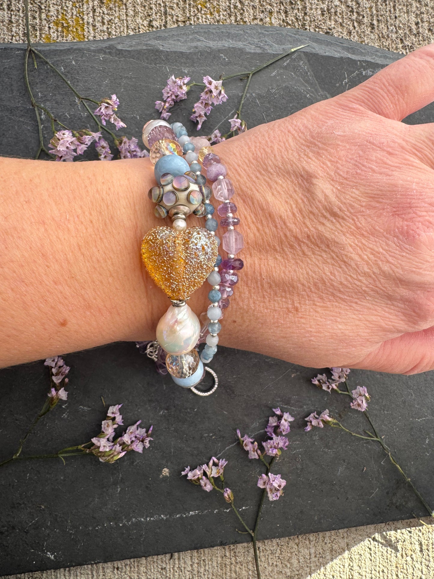 handmade lampwork glass, baroque pearl, blue opal, citrine with AB, moonstone, labradorite, pink opal, amethyst, and kyanite. Rhinestone clasp. Bracelet.