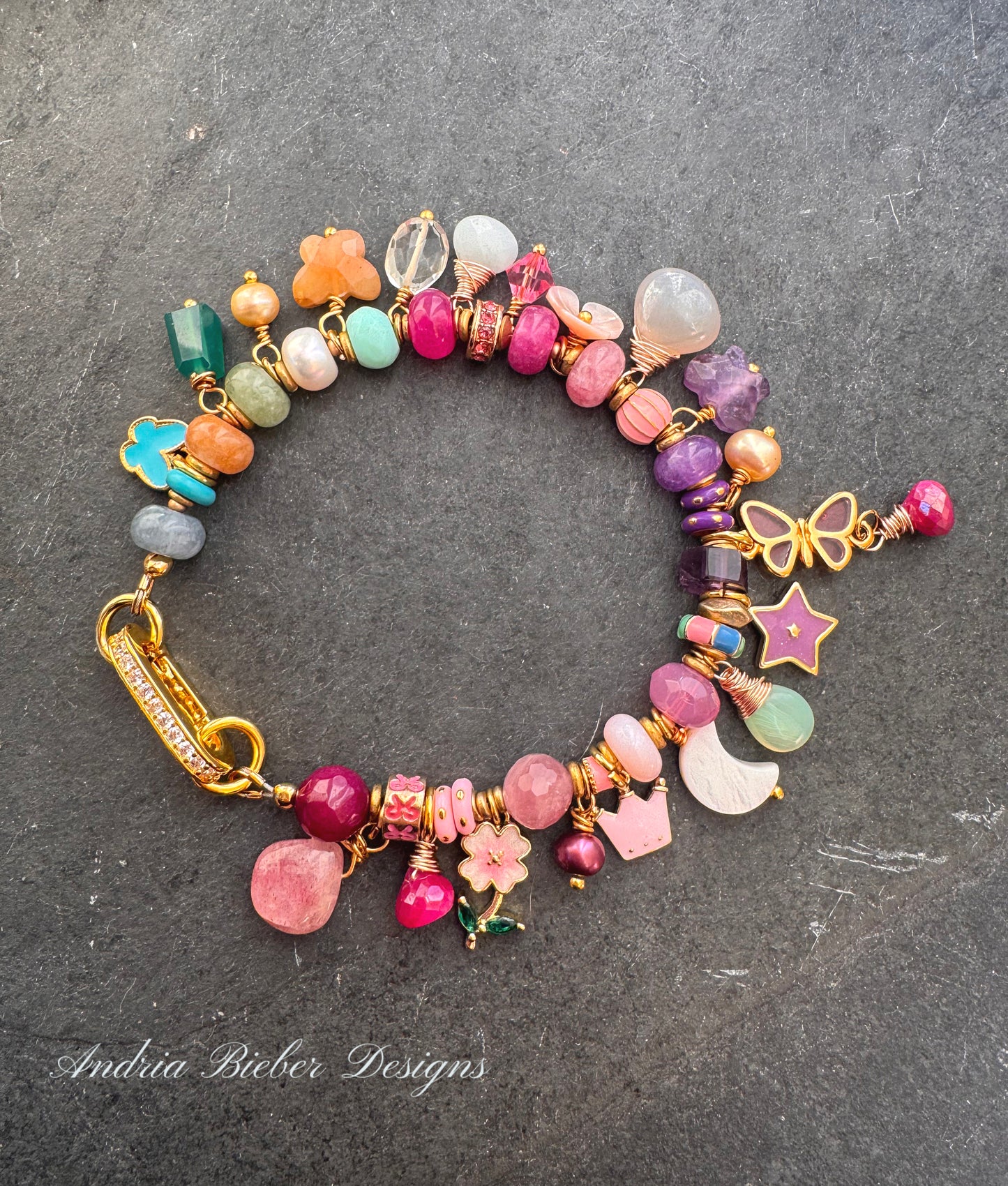 Flower mixed charm bracelet. Mixed stones, pearls and charms, gold metal bracelet.