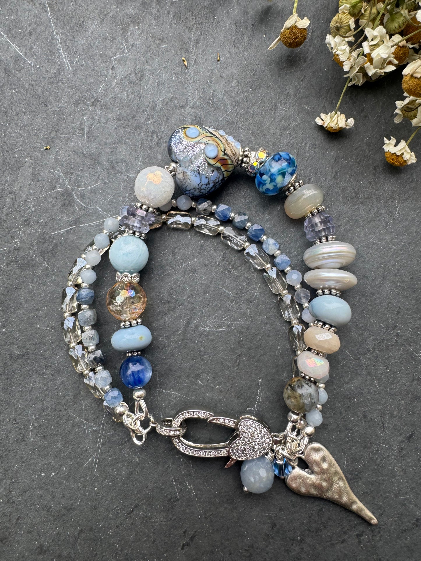 Lamp work glass, blue opal, blue kyanite, mystic moonstone, mystic citrine, pearls, iolite, aquamarine, crazy lace blue agate, blue aventurine stone, silver metal, rhinestone clasp, bracelet