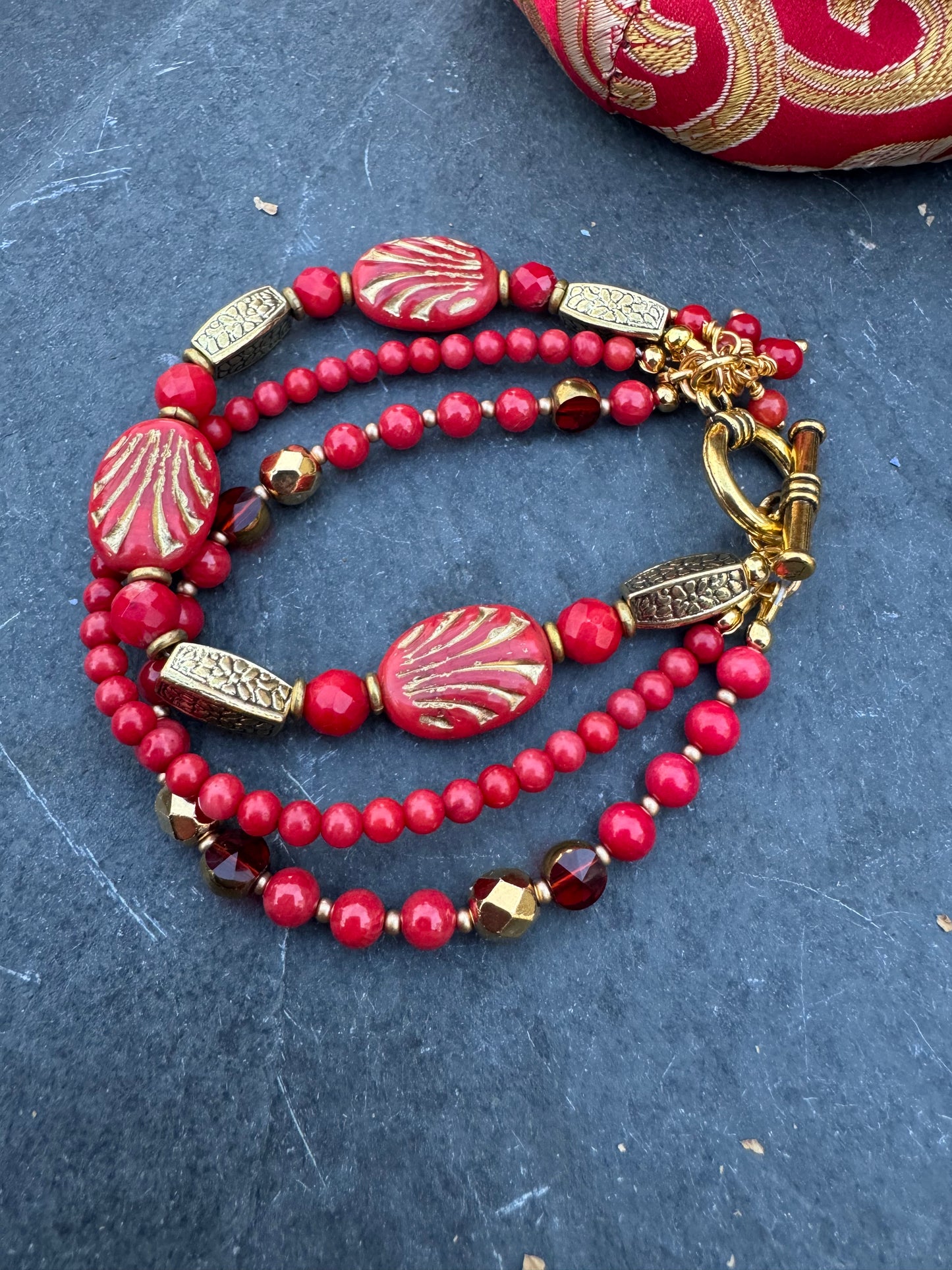 Red Czech glass, red coral, gold metal, bracelet