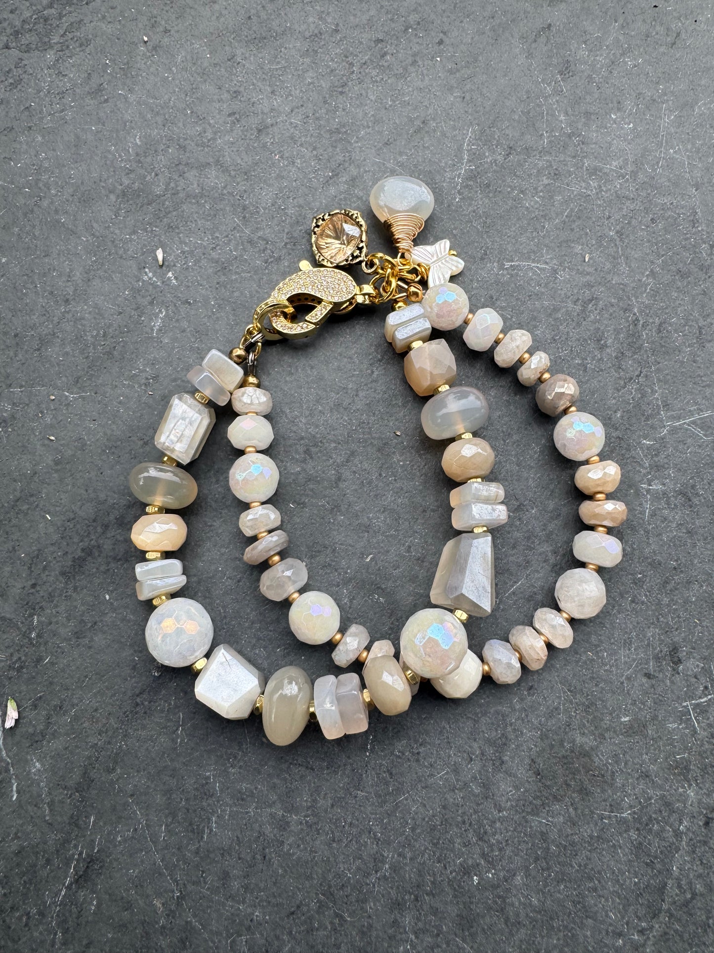Moonstone, rhinestone clasp, two multi strand, gold metal, bracelet.