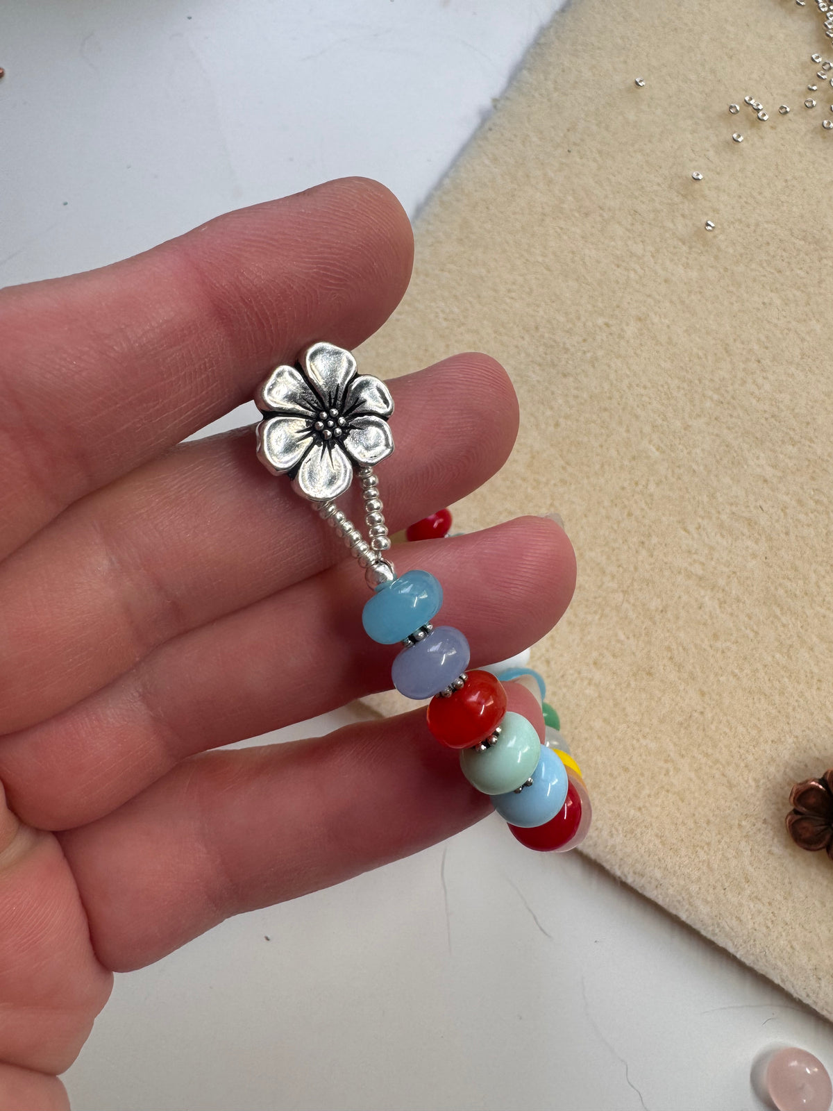 Multi glass, button, silver metal, bracelet.
