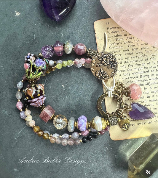 Rose quartz, pink tourmaline, pearls, moonstone, amethyst, handmade lampwork glass, bracelet. Button clasp.