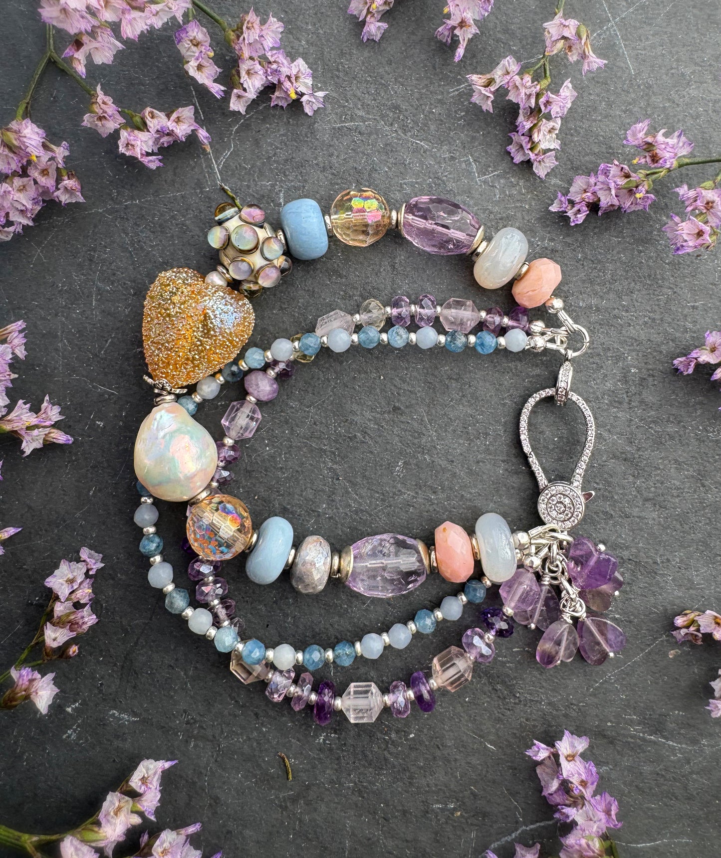 handmade lampwork glass, baroque pearl, blue opal, citrine with AB, moonstone, labradorite, pink opal, amethyst, and kyanite. Rhinestone clasp. Bracelet.