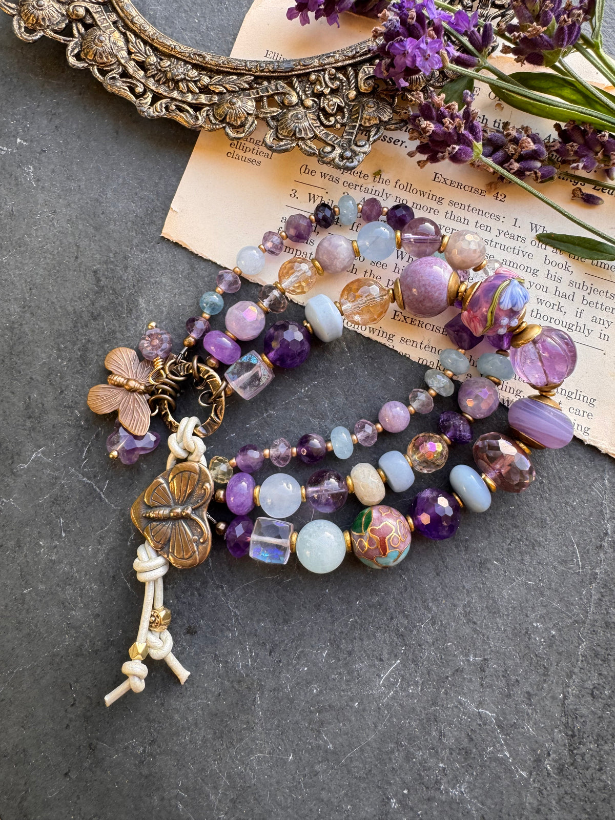 Handmade lampwork glass, 
Amethyst, citrine, aquamarine, faceted green amethyst, fluorite stone, purple oyster, and bronze  butterfly metal button.