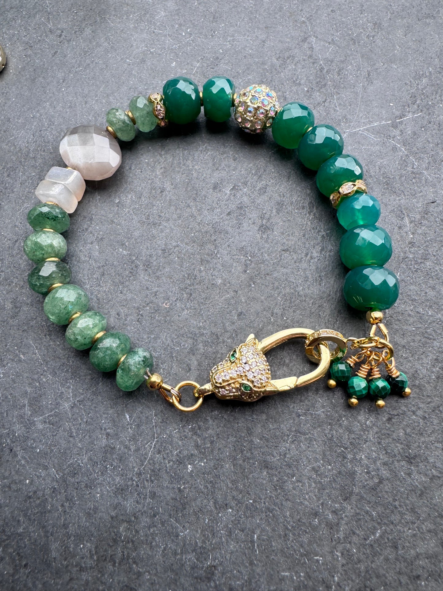 Green onyx faceted stone, green quartz, moonstone,jaguar gold rhinestone clasp.