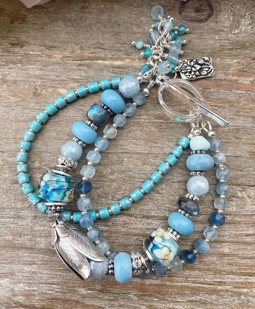 Aquamarine gemstone, lampwork glass, larimar, and silver metal, bracelet