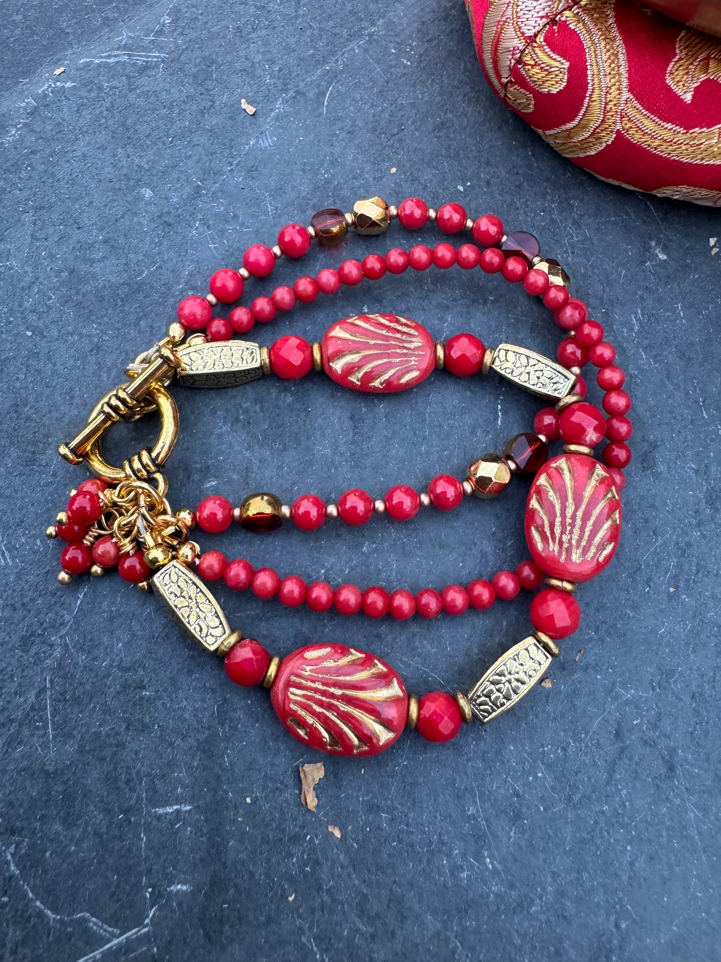 Red Czech glass, red coral, gold metal, bracelet