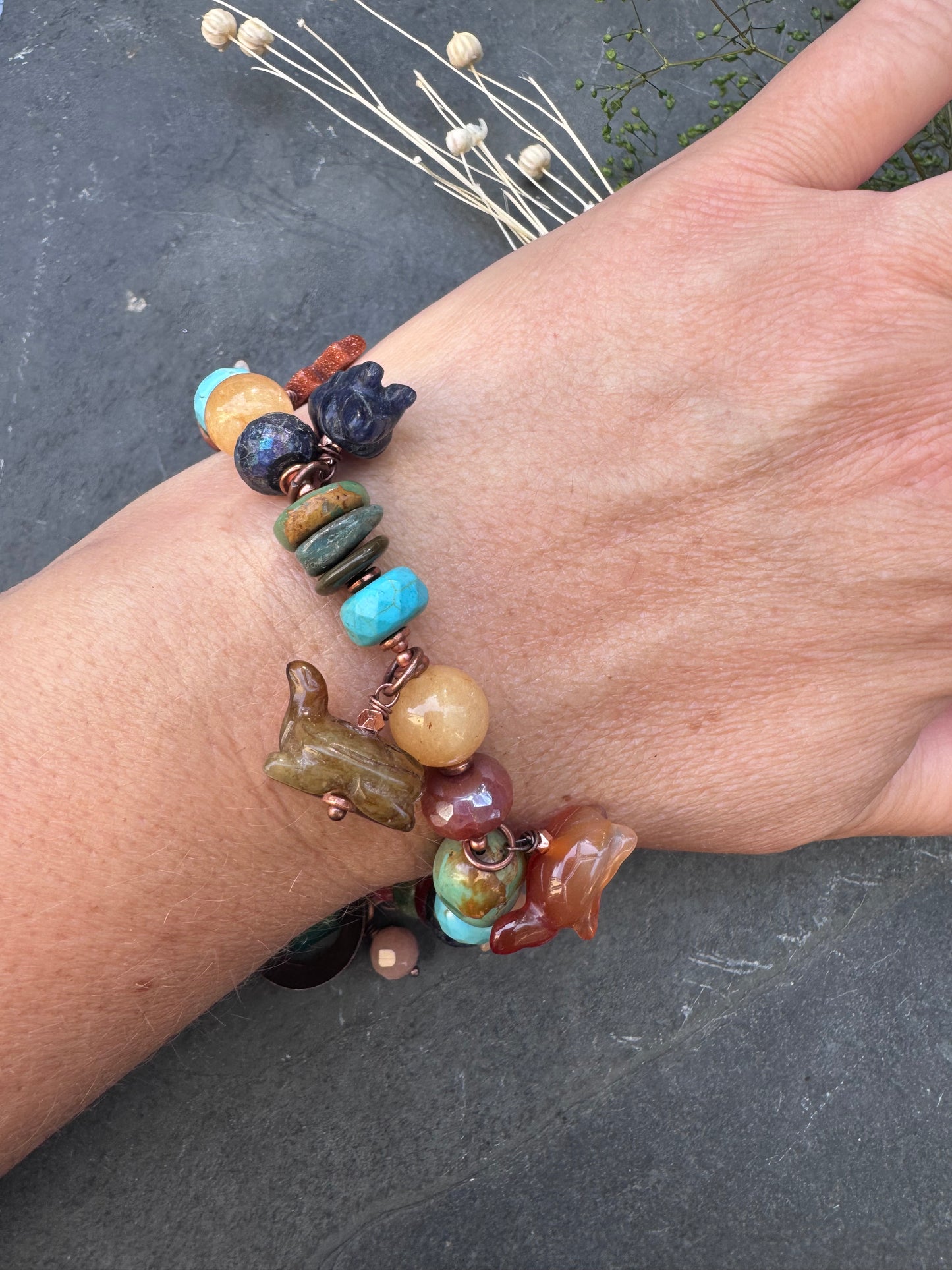 Turquoise, lapis, carnelian agate, sunstone, mixed stone, copper bracelet. Animal stone charms.