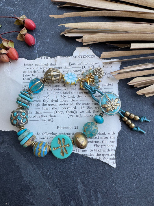 Turquoise stone, Czech glass,African glass, brass metal, bracelet. Czech Button and leather closure.