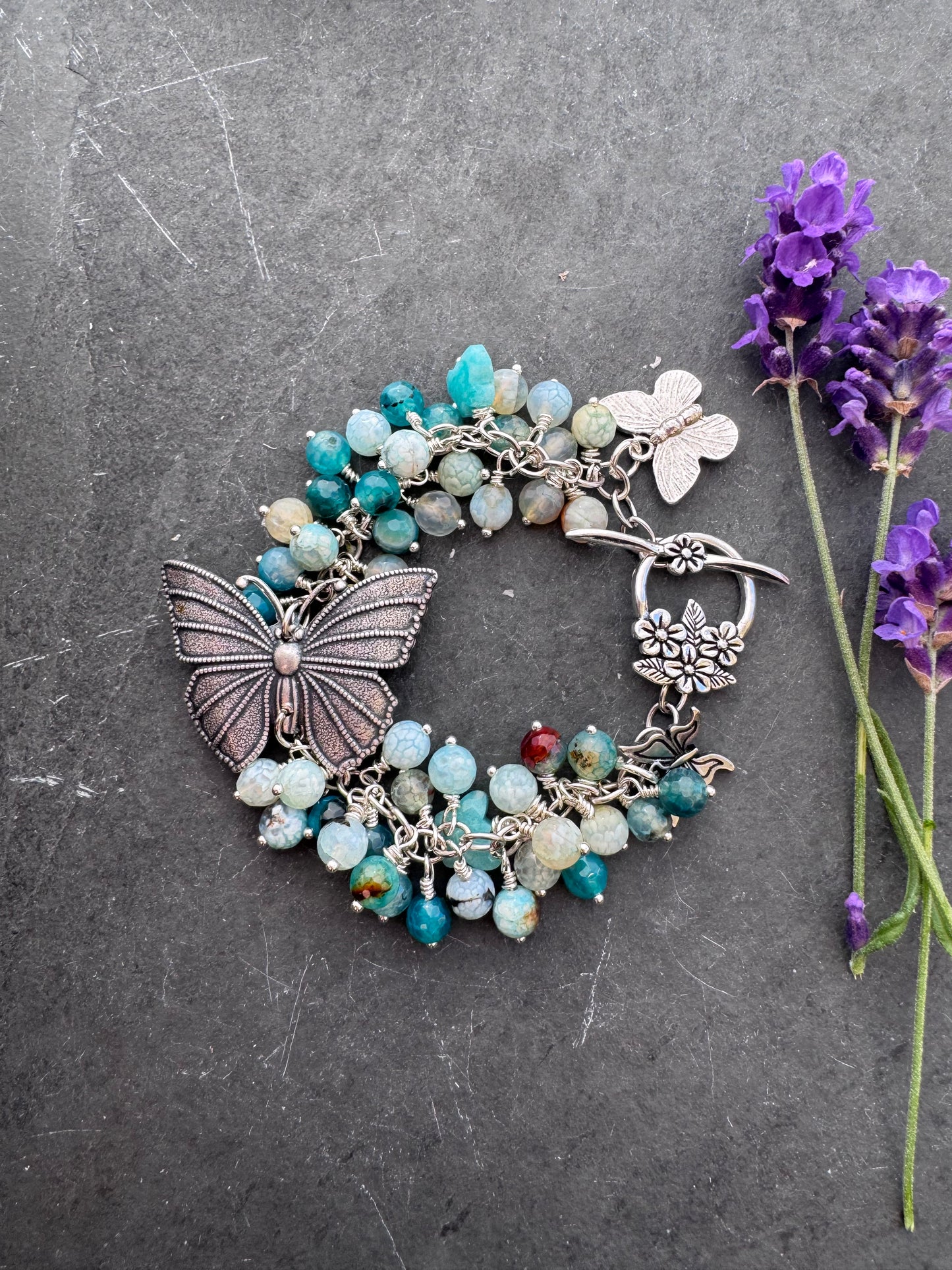 Blue crackled agate stone, butterfly and silver metal bracelet.
