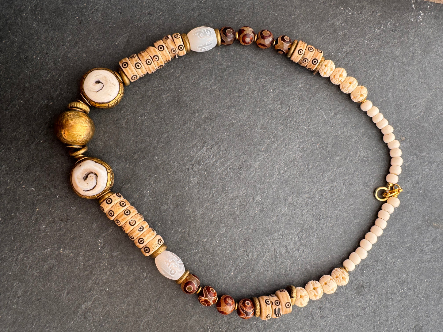 Java glass, African brass, dzi agate, bone, necklace