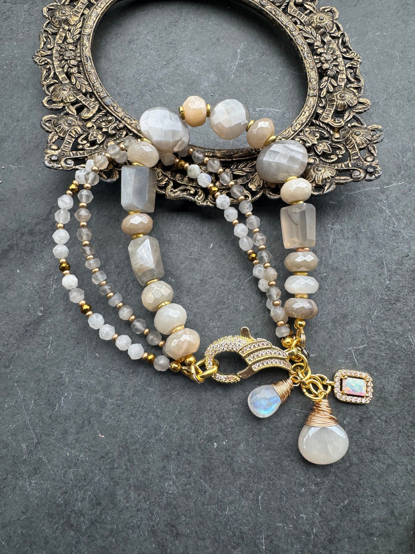 Moonstone, rhinestone clasp, multi strand, gold metal, bracelet.