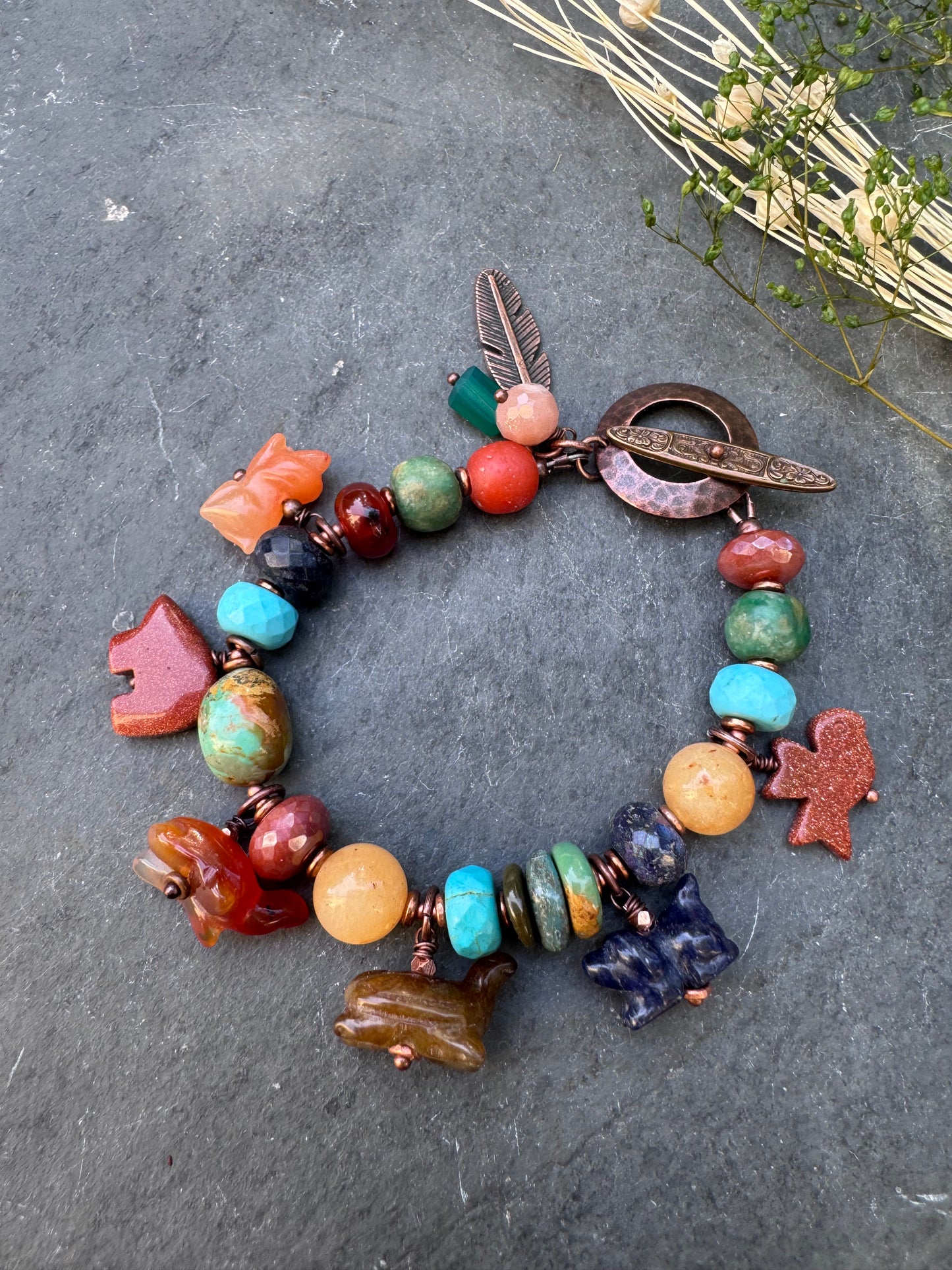 Turquoise, lapis, carnelian agate, sunstone, mixed stone, copper bracelet. Animal stone charms.