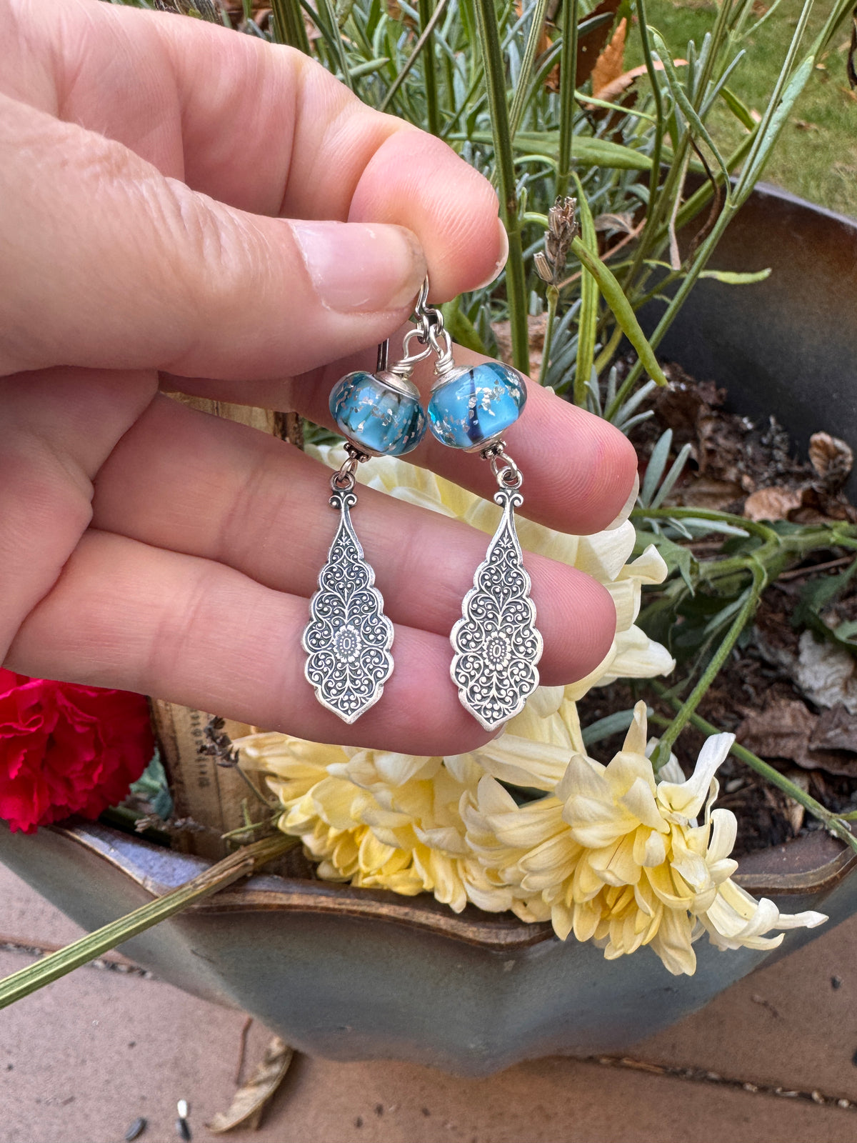 Handmade lampwork glass in blue and black, silver filigree drop, earrings.
