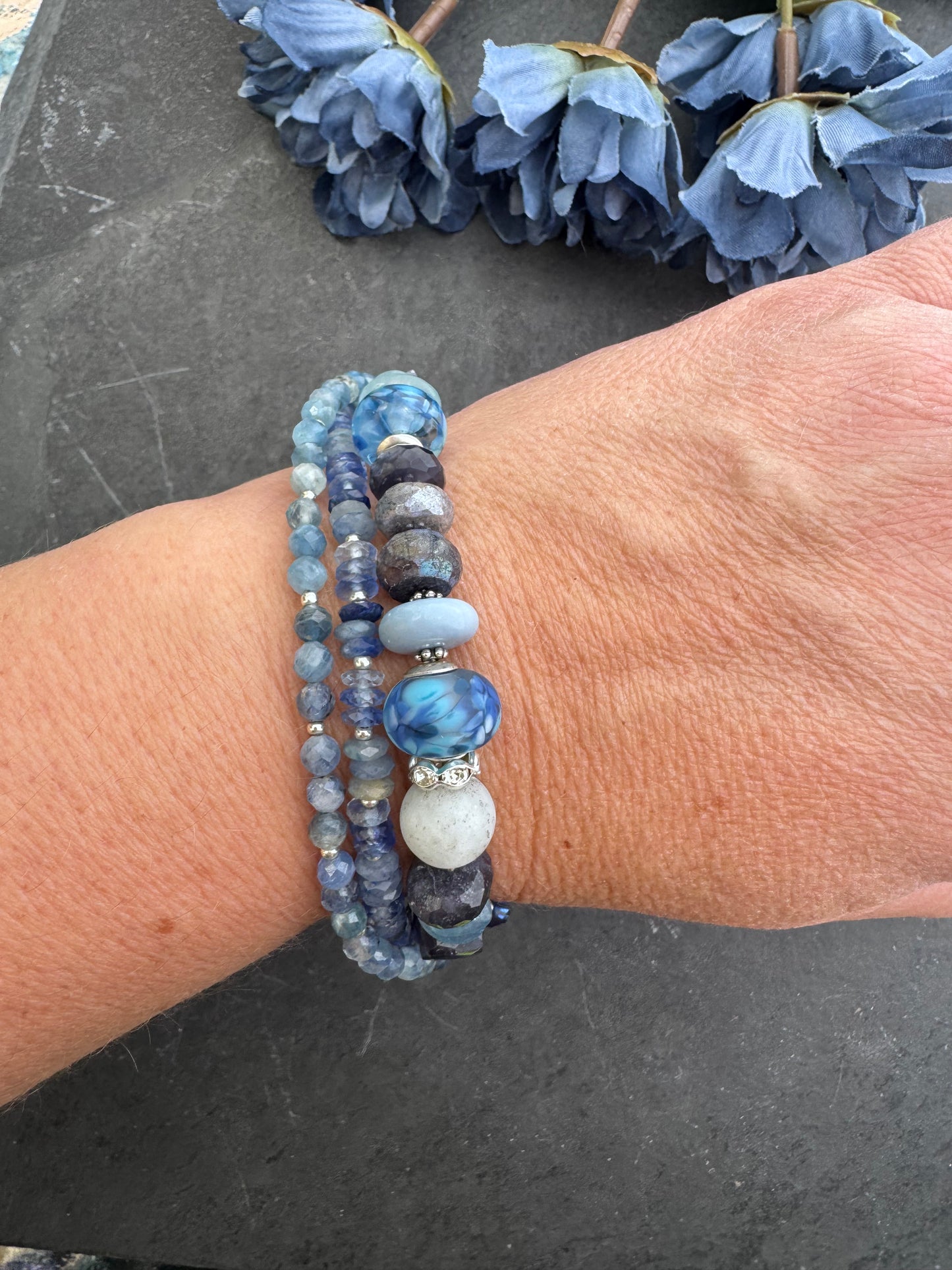 lapis lazuli, isolate, aquamarine, kyanite, Sky Blue Agate, sodalite, handmade lampwork glass, and silver metal Rhinestone clasp in deep blue crystals.