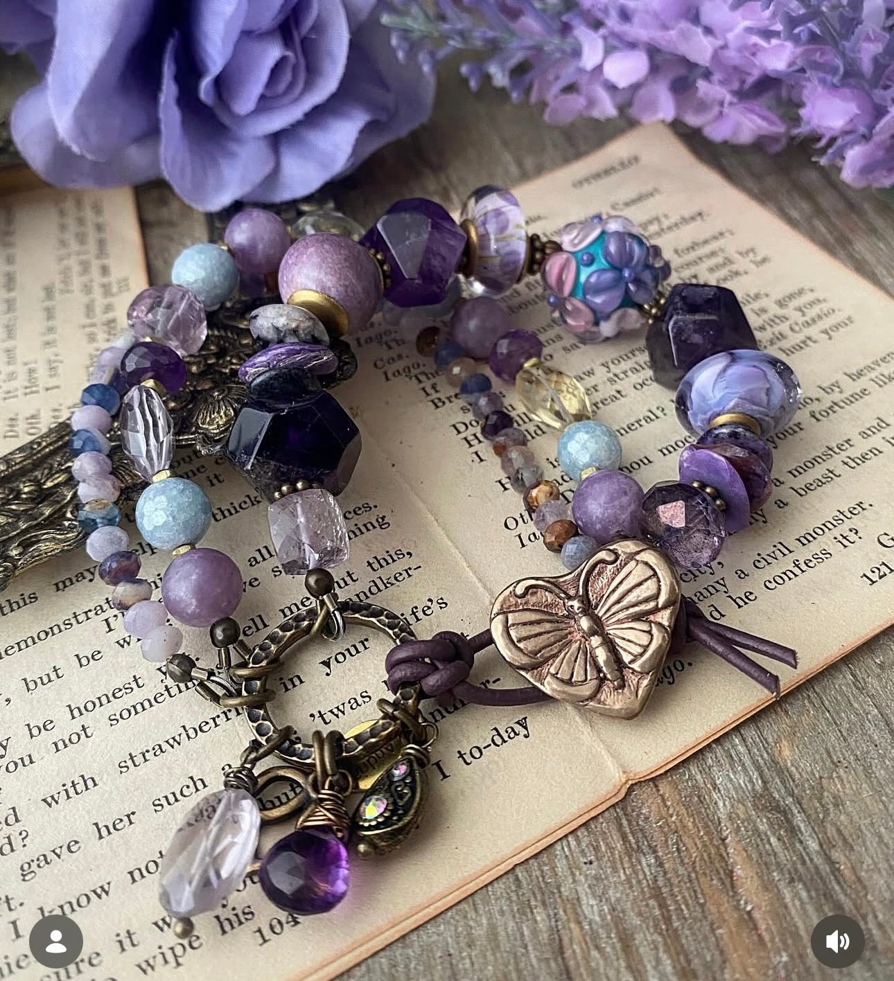 lampwork glass, 
Purple Stichtite, aquamarine, faceted green amethyst, fluorite stone, purple oyster, and bronze butterfly metal button.
