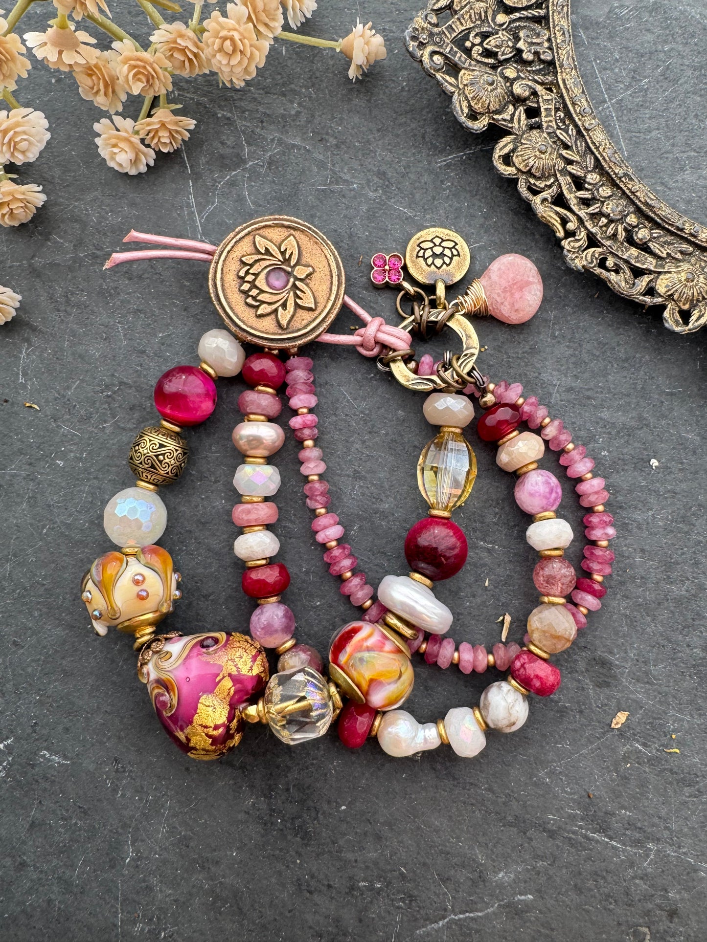 Ruby. handmade lampwork glass, moonstone, strawberry quartz, ruby, pink tourmaline, topaz, pearls, lotus flower button, pink leather, bracelet. MTO.