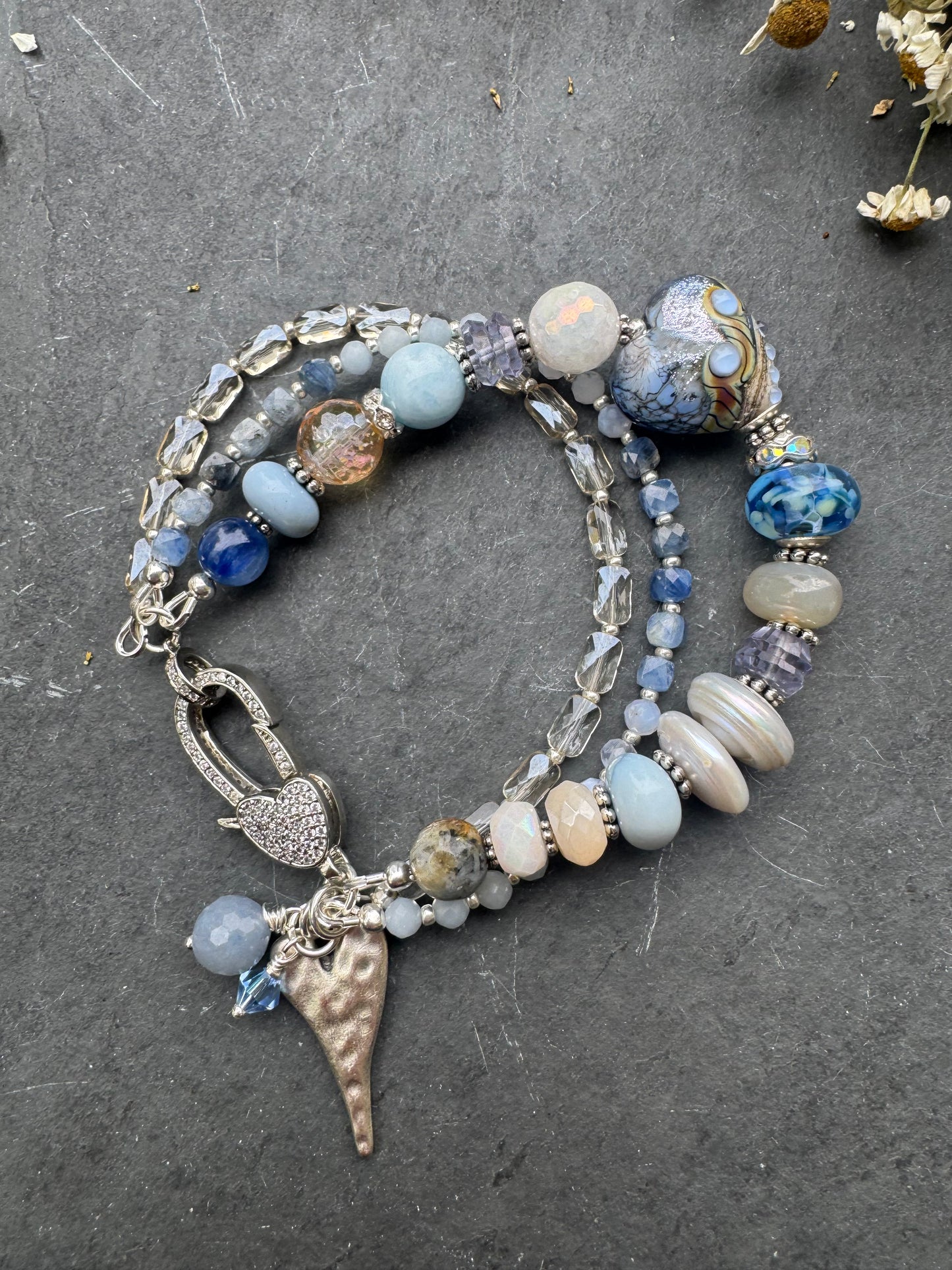 Lamp work glass, blue opal, blue kyanite, mystic moonstone, mystic citrine, pearls, iolite, aquamarine, crazy lace blue agate, blue aventurine stone, silver metal, rhinestone clasp, bracelet