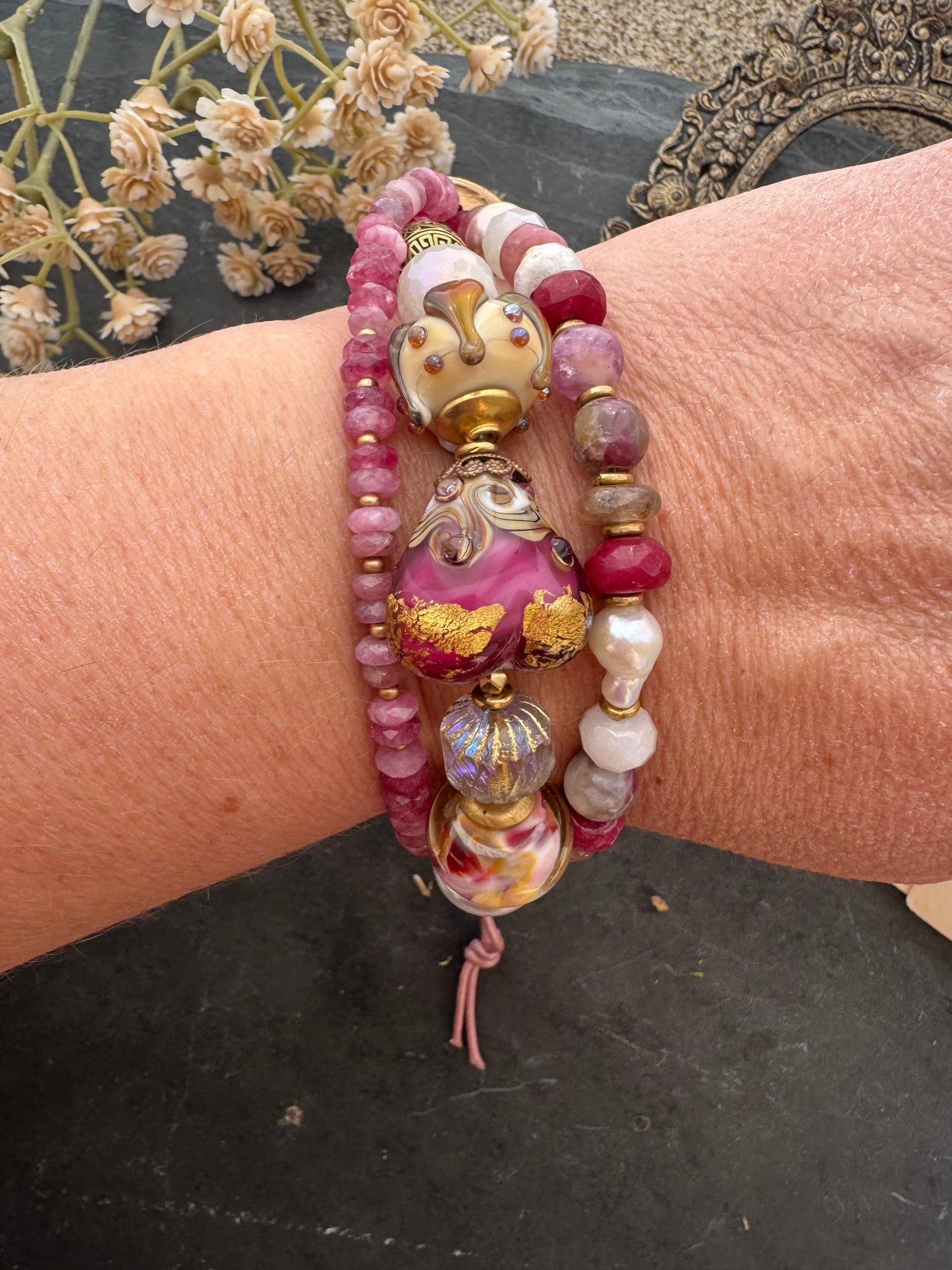 Ruby. handmade lampwork glass, moonstone, strawberry quartz, ruby, pink tourmaline, topaz, pearls, lotus flower button, pink leather, bracelet. MTO.