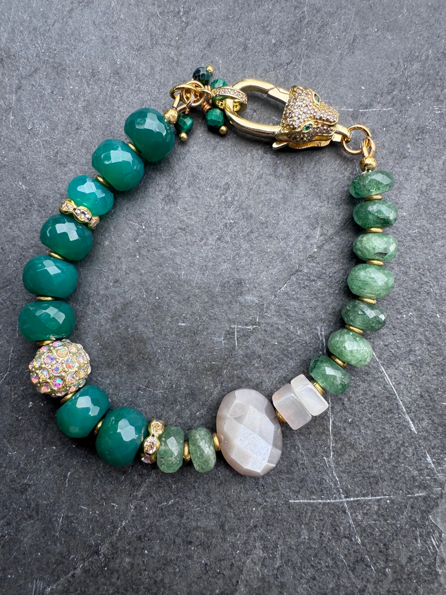 Green onyx faceted stone, green quartz, moonstone,jaguar gold rhinestone clasp.