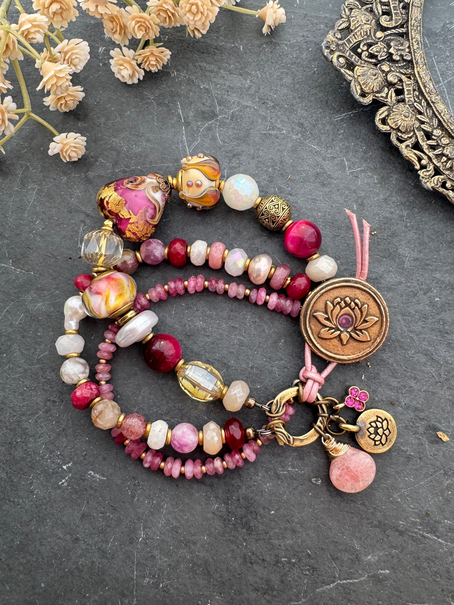 Ruby. handmade lampwork glass, moonstone, strawberry quartz, ruby, pink tourmaline, topaz, pearls, lotus flower button, pink leather, bracelet. MTO.