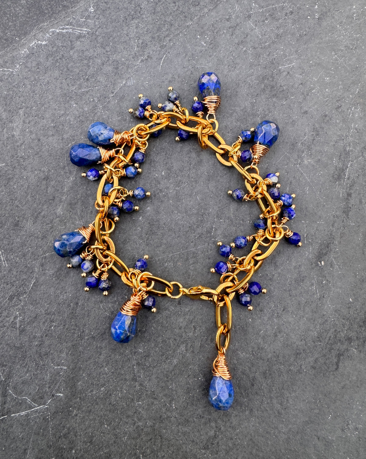 Lapis lazuli and gold chain metal bracelet.