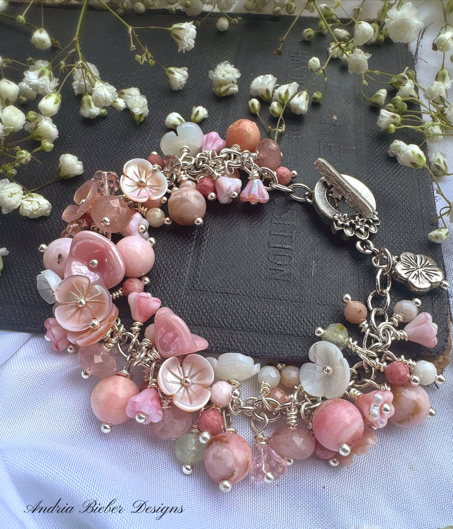 Pink opal, pink shell blossoms, rose quartz, peridot, sterling silver metal, blossom clasp, bracelet.