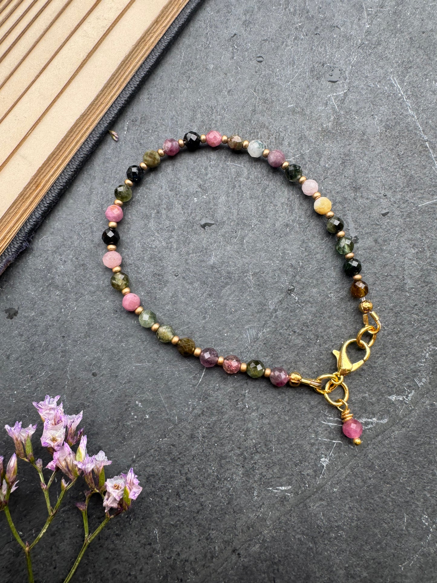 Watermelon tourmaline faceted round stone, gold metal, bracelet