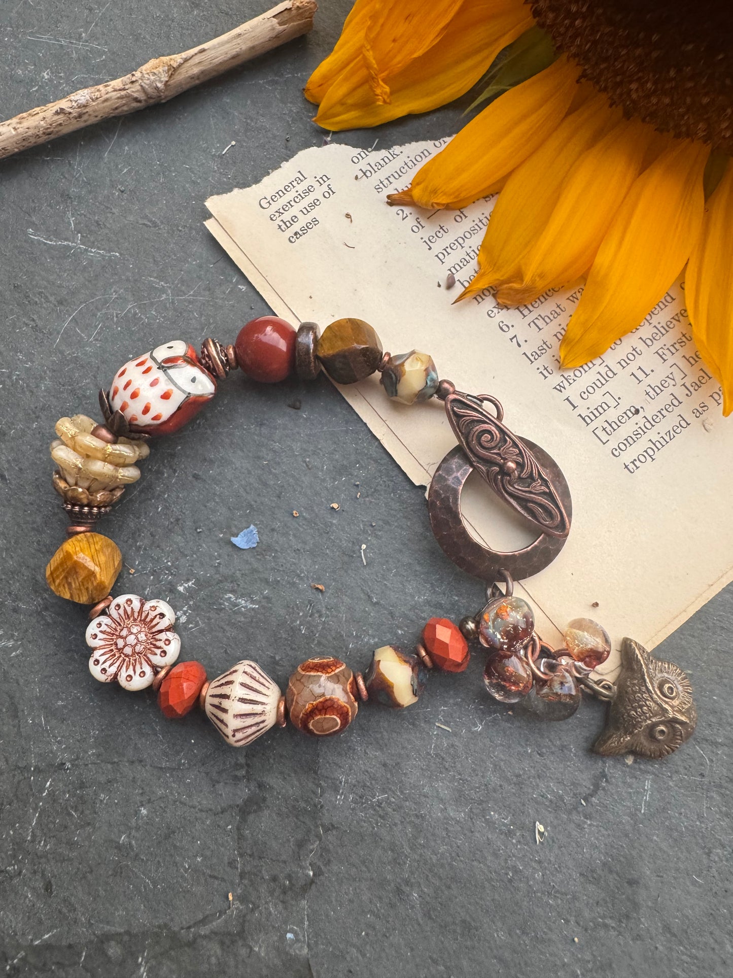 Tiger eye, jasper, agate, czech glass, lampwork glass, ceramic, copper metal. Owl theme.