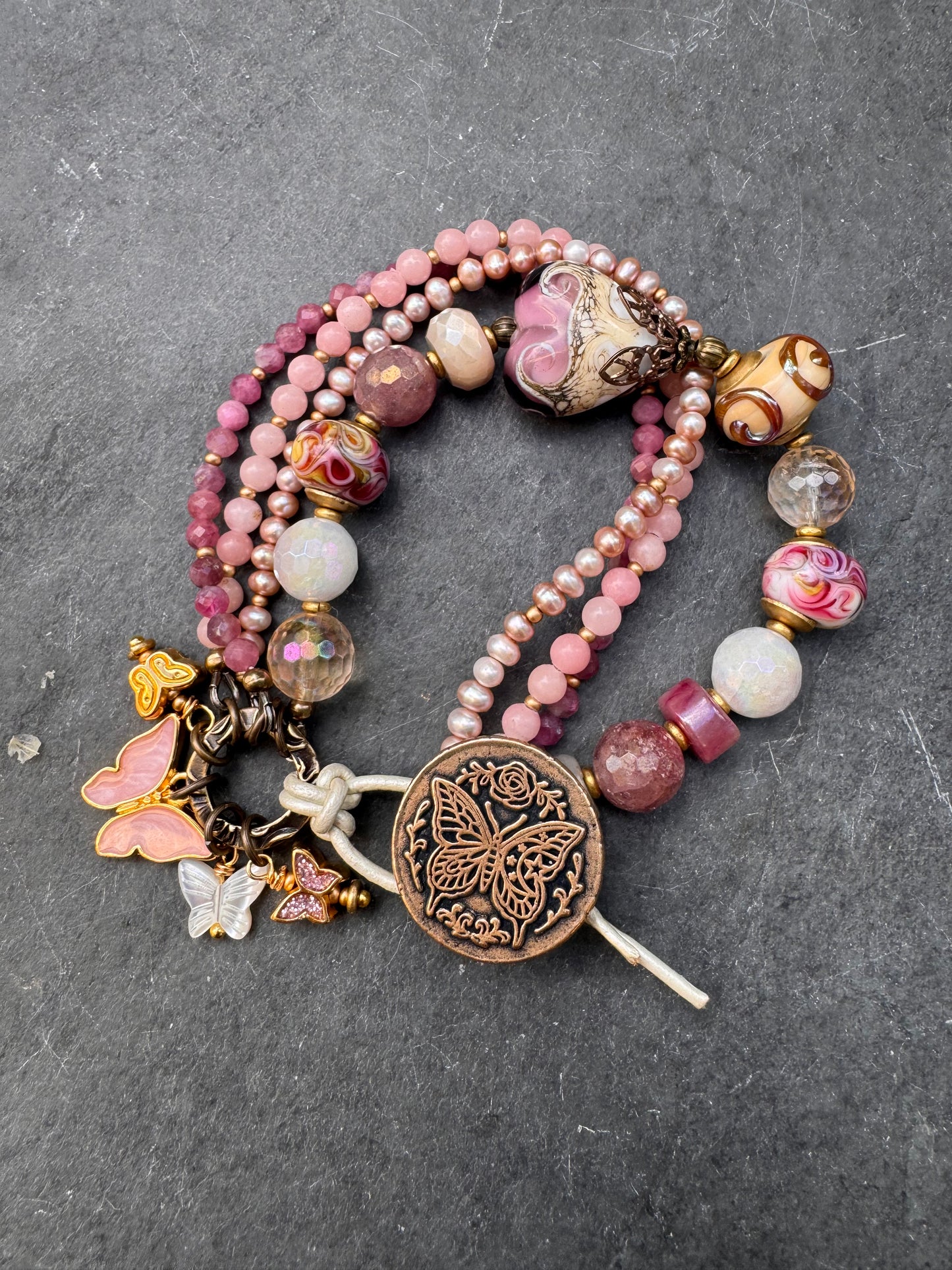Pink opal, pink Tourmaline, moonstone mystic, strawberry quartz mystic, citrine mystic, pink pearls and handmade lamp work glass, bronze butterfly button, white leather.