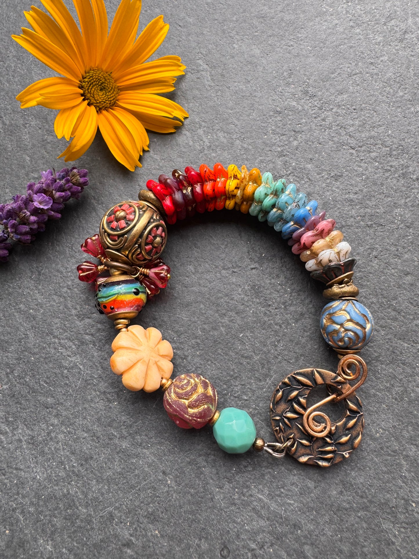 Rainbow flowers. Nepal coral flower bead, Mixed Czech glass flowers, lampwork glass, leaf bronze toggle clasp.