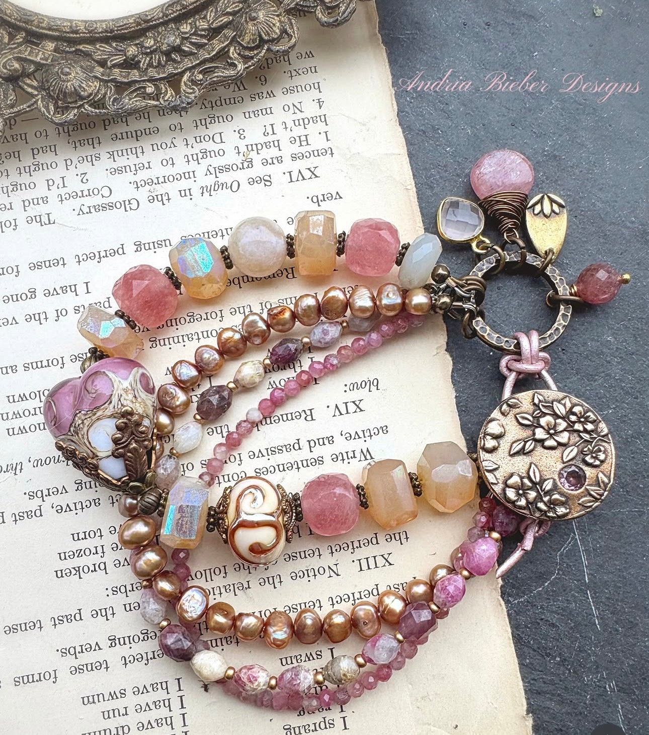Pink cherry blossom. handmade lampwork glass, AB moonstone, strawberry quartz, pink tourmaline, topaz pearls, cherry blossom button, pink leather, bracelet. MTO.